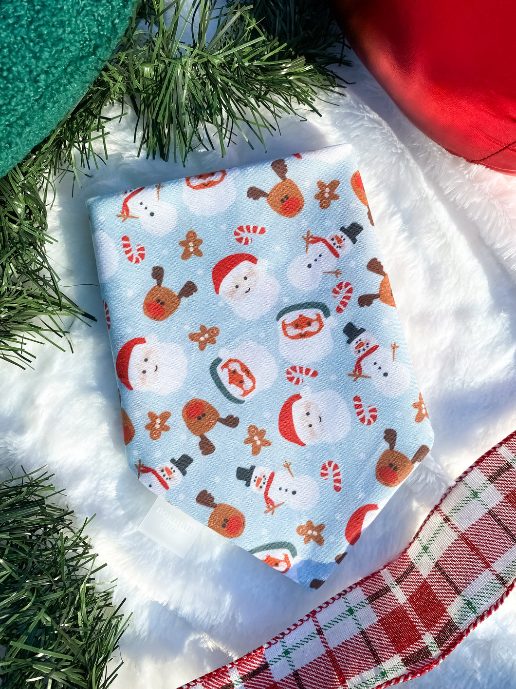 Santa, reideer, candy cane, gingerbread on blue background dog bandana.